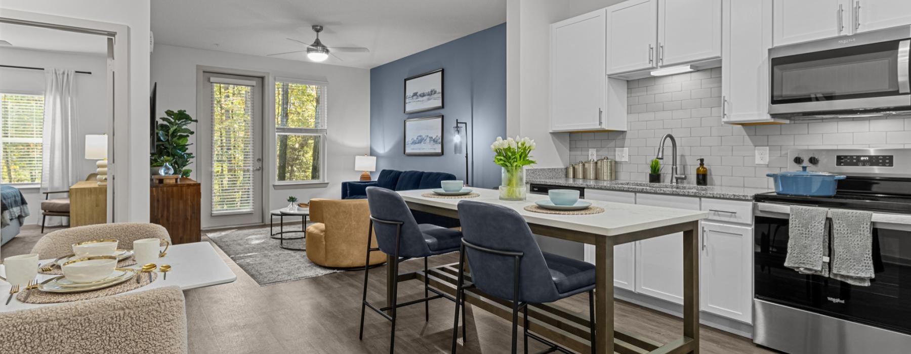a kitchen with a dining table and chairs